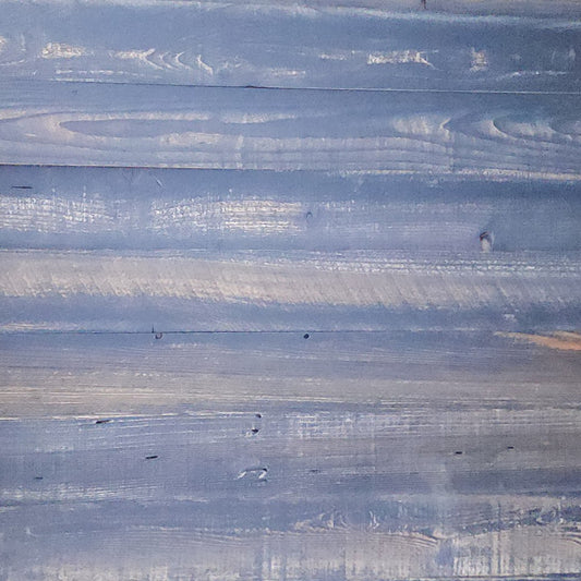 Close up of black finish reclaimed redwood showing grain, checking and original nail holes