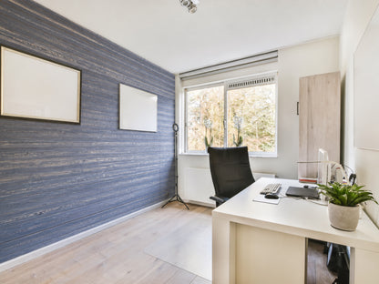 Black reclaimed redwood wall planks installed as an interior accent wall