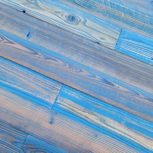Close up of blue finish reclaimed redwood showing weathered texture and board to board variation