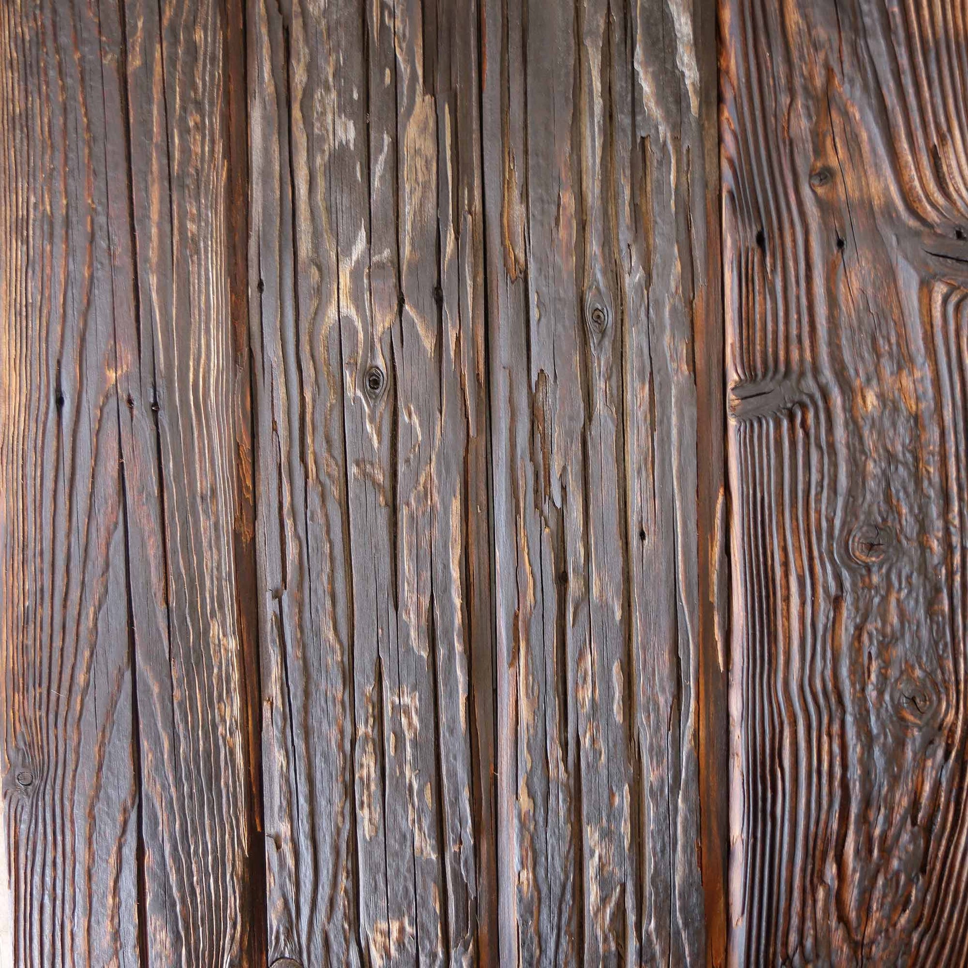 Close detail of mushroom wood texture with nail holes and rust staining
