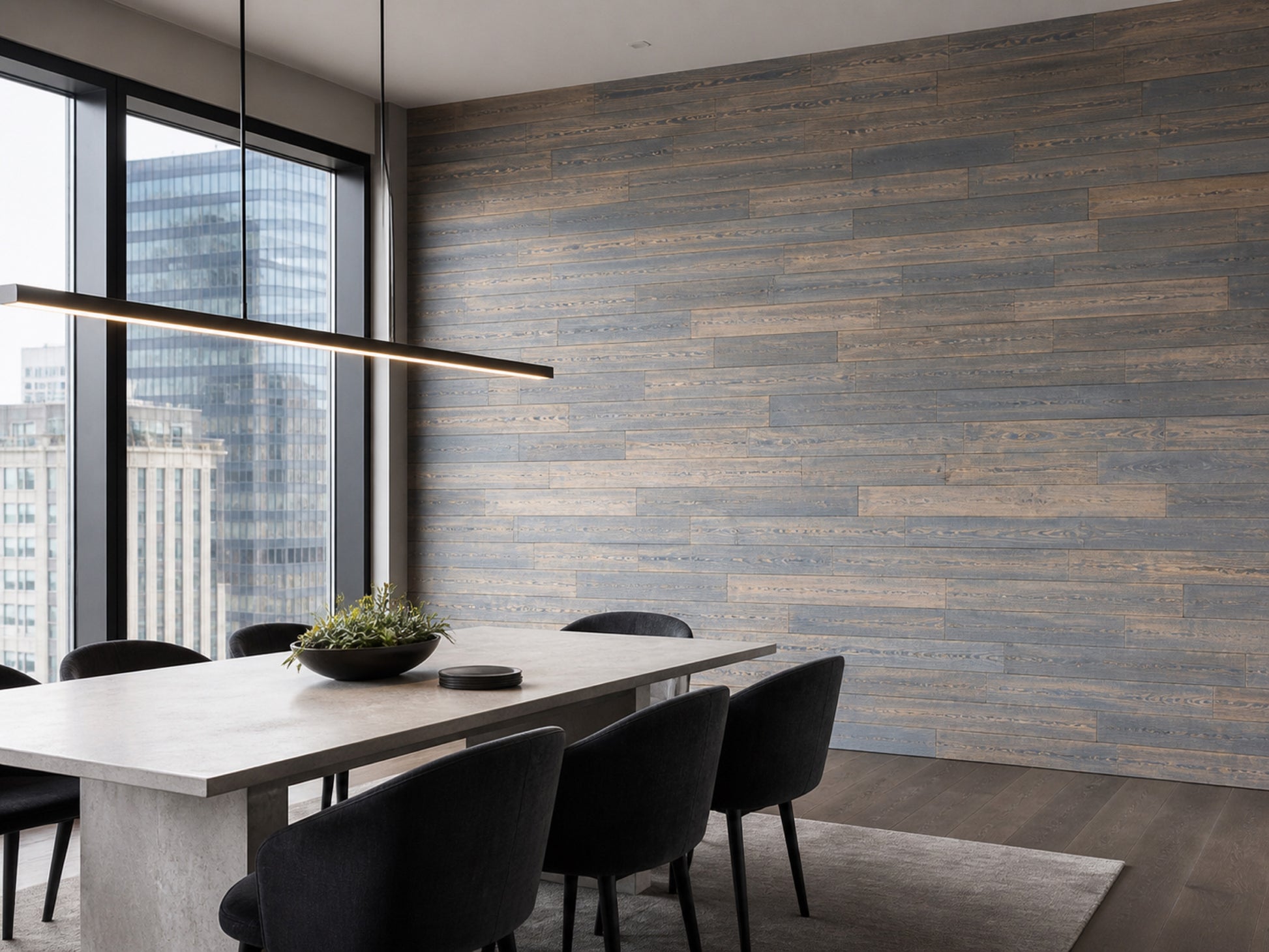Grey reclaimed redwood wall planks installed in a dining room