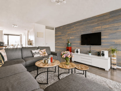 Grey reclaimed redwood wall planks installed as an interior accent wall