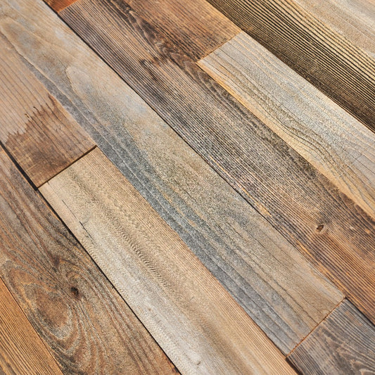 Close up of natural reclaimed redwood showing weathered grain, checking and saw marks