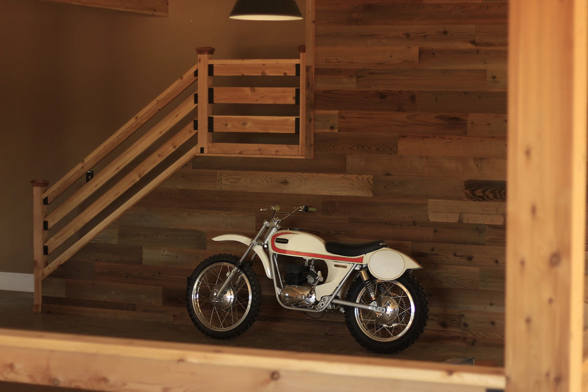 Reclaimed barnwood wall paneling installed in a luxury garage