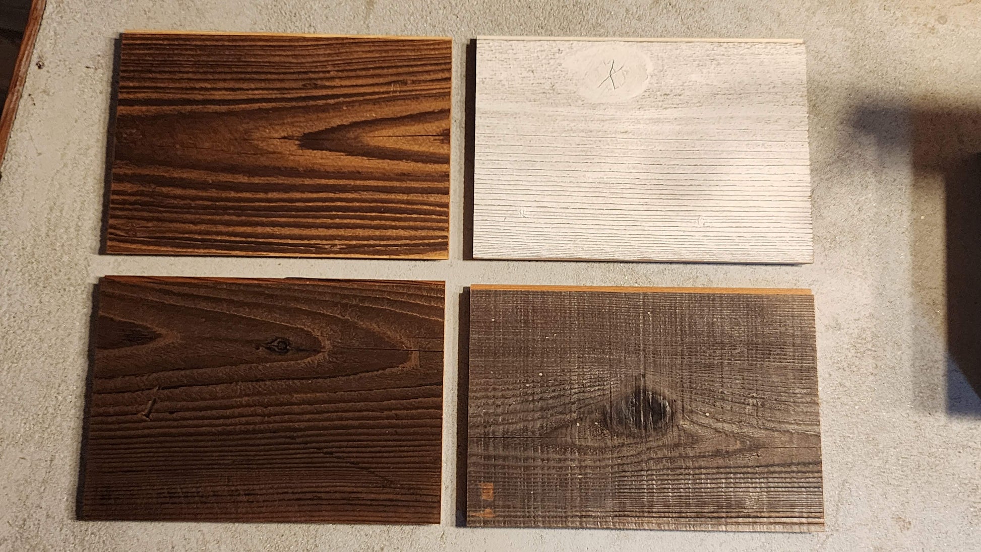 Samples of reclaimed wood with different finishes.