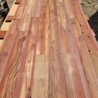 Red finish reclaimed redwood showing board to board color variation across a full layout