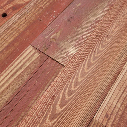 Close up of red finish reclaimed redwood showing grain, checking and saw marks