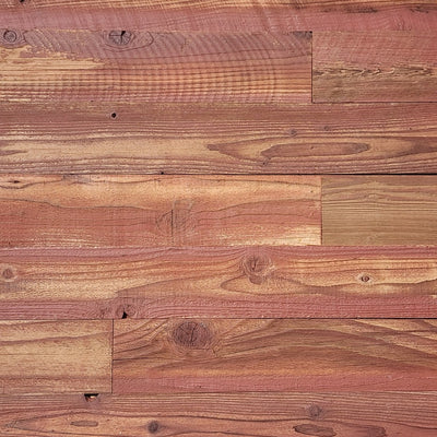 Red finish reclaimed redwood S3S wall planks laid flat, warm terracotta over visible grain