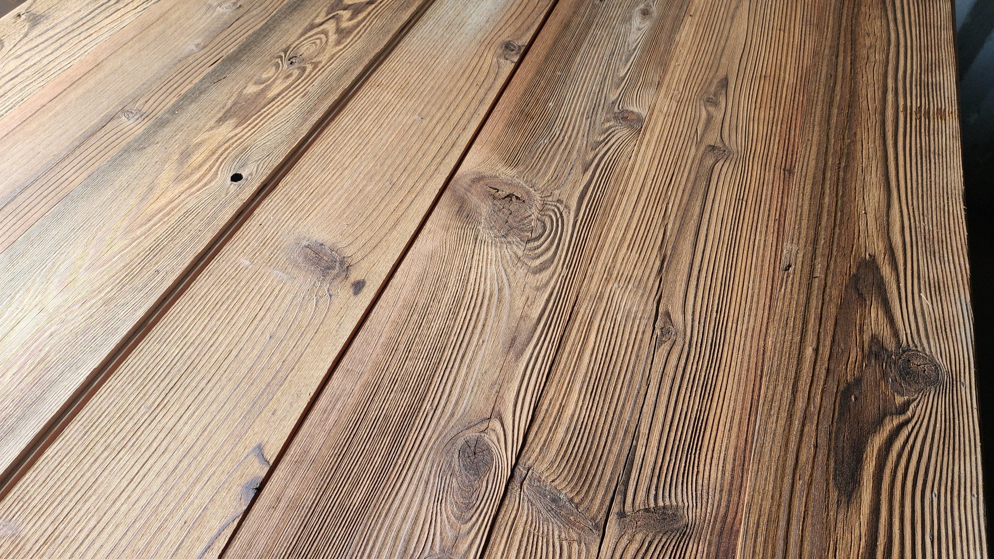 Brushed finish S3S reclaimed redwood planks with fine tight grain and warm brown tone