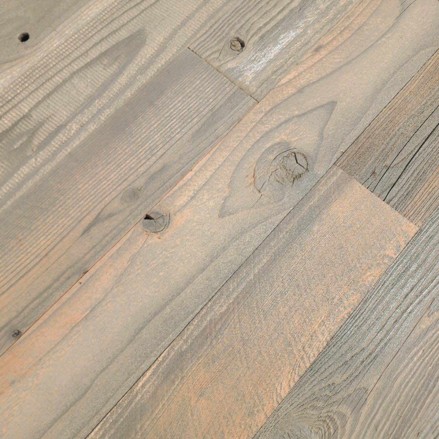 Close up of tan finish reclaimed redwood showing grain and original nail holes