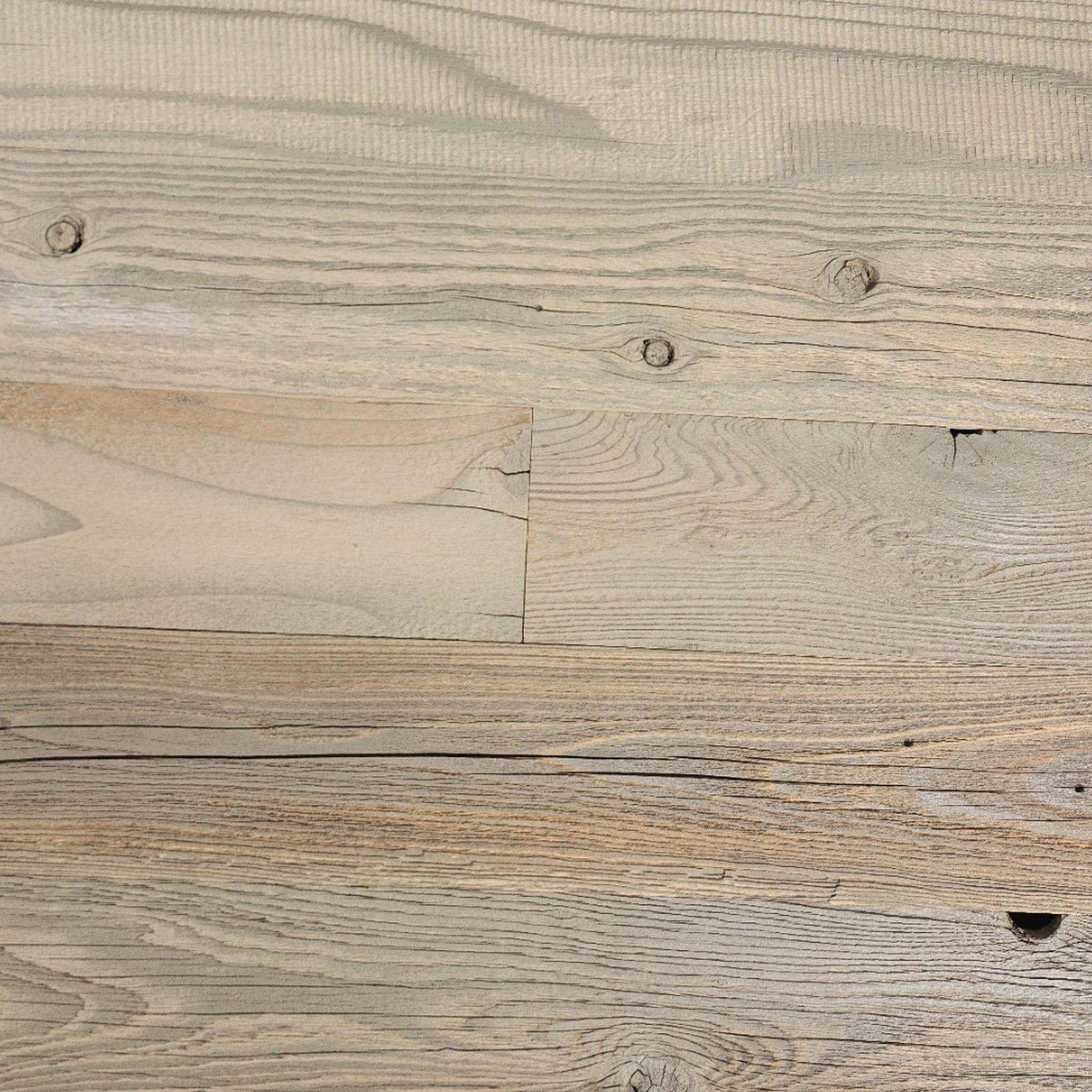 Tan finish reclaimed redwood S3S wall planks laid flat, warm sand tone over visible grain