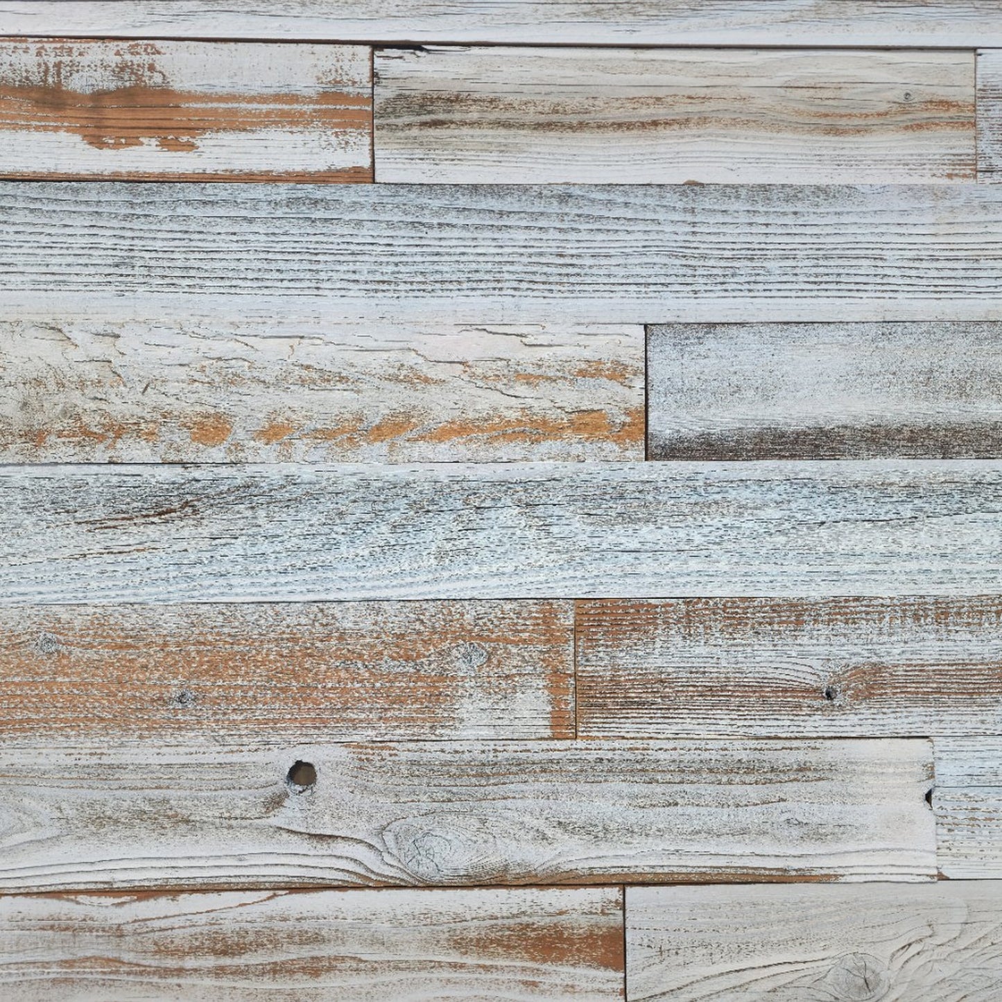 Whitewash finish reclaimed redwood S3S wall planks laid flat, thinned white sitting in the grain
