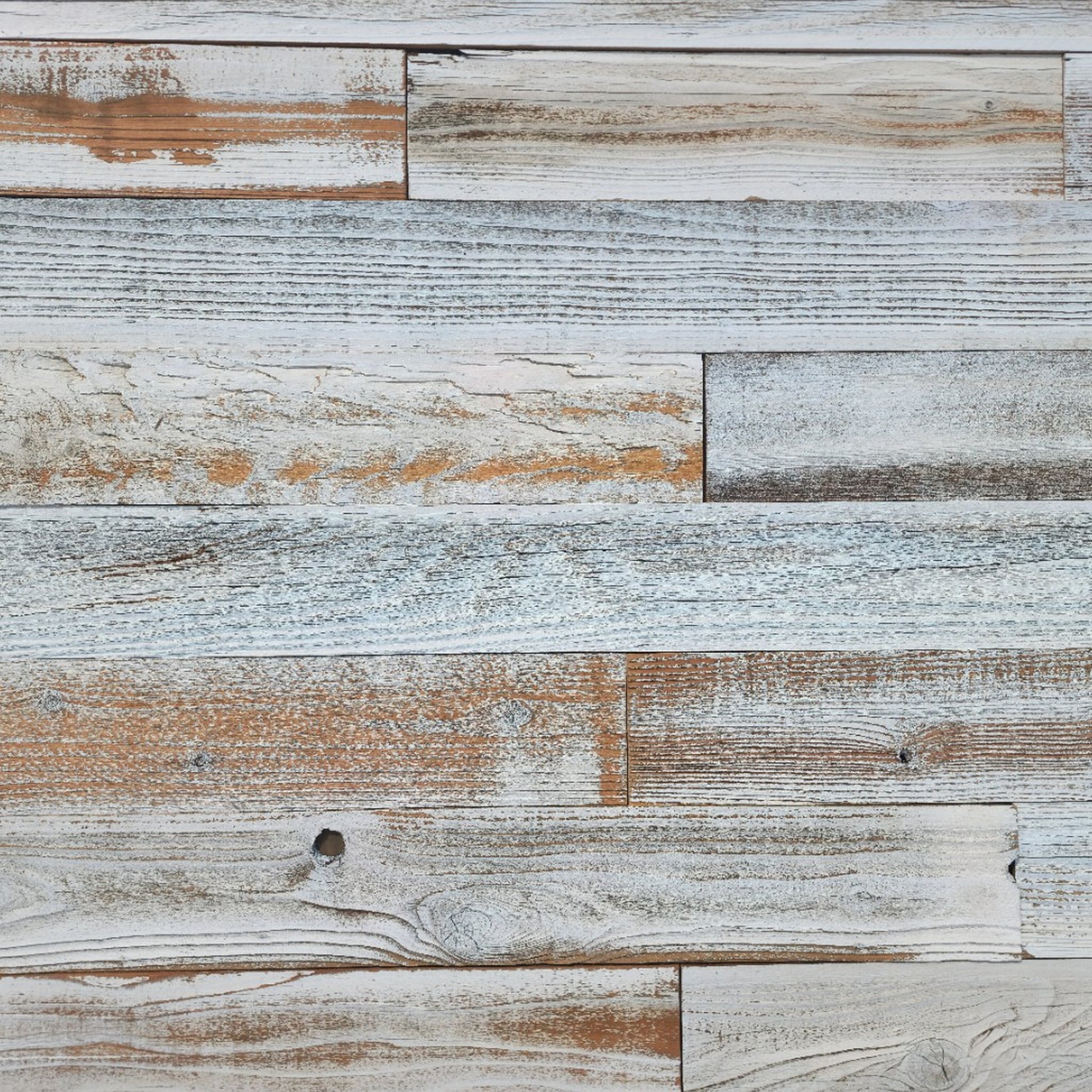 Whitewash finish reclaimed redwood S3S wall planks laid flat, thinned white sitting in the grain
